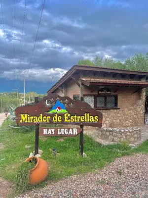 a sign in front of a small building at MIRADOR DE ESTRELLAS RESORT in Nono