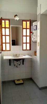 a bathroom with a sink and a mirror at Cerro de las Rosas in Cordoba