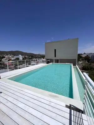 a swimming pool on the roof of a house at Departamento en el centro - Lake Tower in Villa Carlos Paz