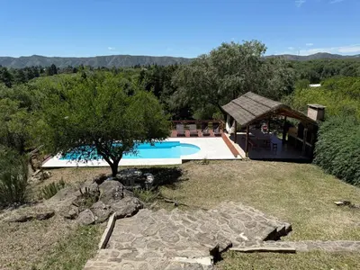 an image of a swimming pool in a yard at Buena Vista Icho Cruz in Villa Icho Cruz