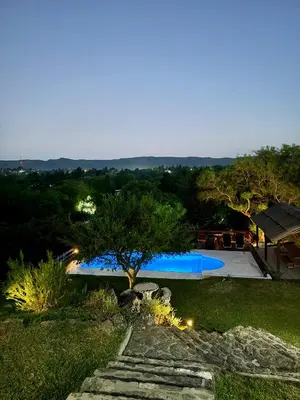 a view of a swimming pool at night at Buena Vista Icho Cruz in Villa Icho Cruz