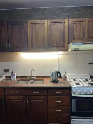 a kitchen with a sink and a stove at Duplex del Cerro in Cordoba