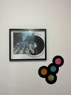 a framed picture of a group of records on a wall at Duplex del Cerro in Cordoba