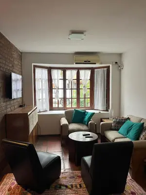 a living room with a couch and a table at Duplex del Cerro in Cordoba