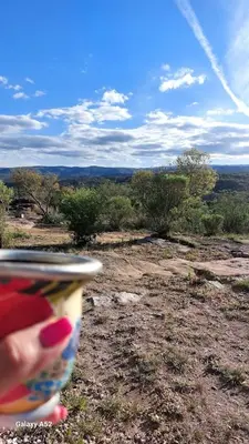 a person is holding a frisbee in a field at La Loma del Valle in Tanti