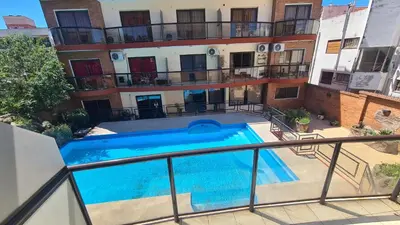 a swimming pool on the balcony of a building at Escaparte nunca se sintió tan bien, este es tu rincón para disfrutar in Villa Carlos Paz