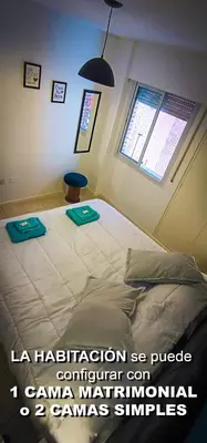 a bedroom with a large bed with two trays on it at Departamento SANATORIO ALLENDE - OULTON - GÜEMES - CENTRO - 5 MIN HOSPITAL PRIVADO - QUALITY - CÓRDOBA in Cordoba