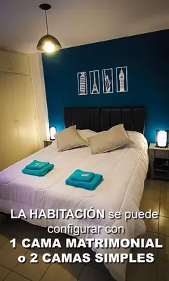 a bedroom with a bed with two towels on it at Departamento SANATORIO ALLENDE - OULTON - GÜEMES - CENTRO - 5 MIN HOSPITAL PRIVADO - QUALITY - CÓRDOBA in Cordoba