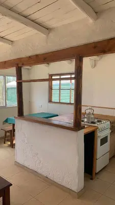 a kitchen with a counter top in a room at Espejo Escondido in Tanti