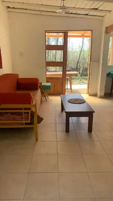 a living room with a couch and a coffee table at Espejo Escondido in Tanti