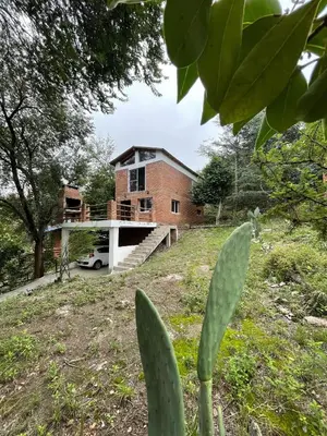 a house in the middle of a field at Tila Huasi in Villa Icho Cruz