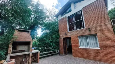 a brick building with a door and a brick oven at Tila Huasi in Villa Icho Cruz