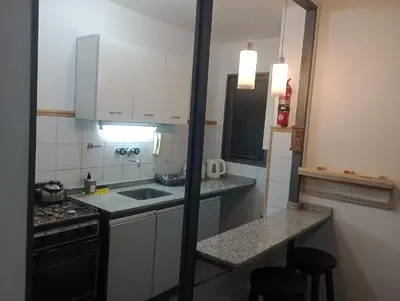 a small kitchen with a sink and a stove at Depto. Lindo Excelente Ubicación in Cordoba