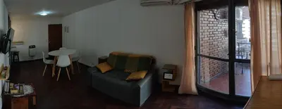 a living room with a couch and a table at Depto. Lindo Excelente Ubicación in Cordoba