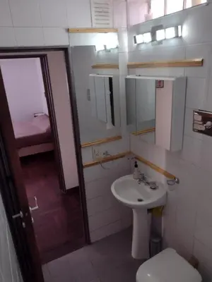 a bathroom with a sink and a toilet at Depto. Lindo Excelente Ubicación in Cordoba