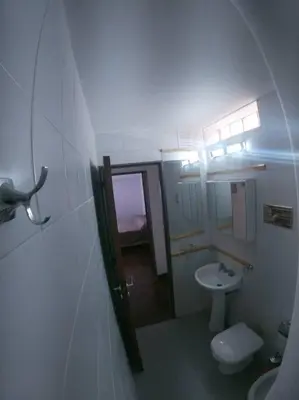 a small bathroom with a toilet and a sink at Depto. Lindo Excelente Ubicación in Cordoba