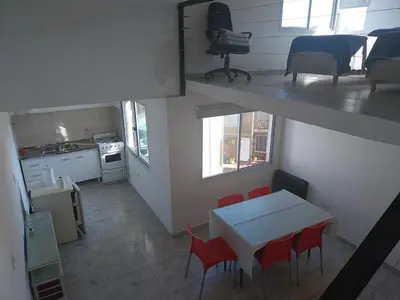 an overhead view of a kitchen and a table and chairs at Talamochita in Santa Rosa de Calamuchita