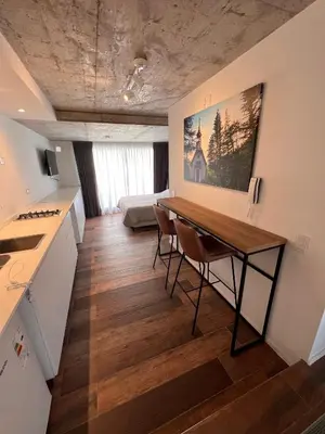 a kitchen with a table and chairs in a room at Departamentos en Barrio Gral Paz a pocos metros de clínicas in Cordoba