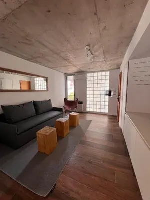 a living room with a couch and a table at Departamentos en Barrio Gral Paz a pocos metros de clínicas in Cordoba