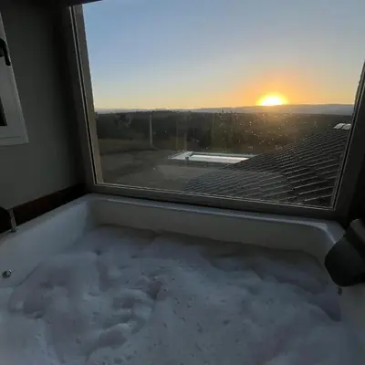a bath tub filled with snow in front of a window at Las Calandrias in La Cumbrecita
