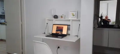 a room with a white shelf with a laptop on it at Departamento Nueva Cordoba in Cordoba