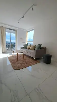 a living room with a couch and a table at Apartamento -Diva- Complejo 