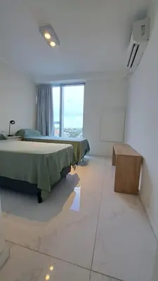 a bedroom with a bed and a large window at Apartamento -Diva- Complejo 