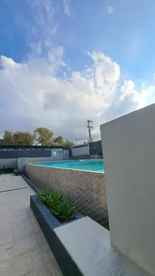 a swimming pool on top of a building at Apartamento -Diva- Complejo 