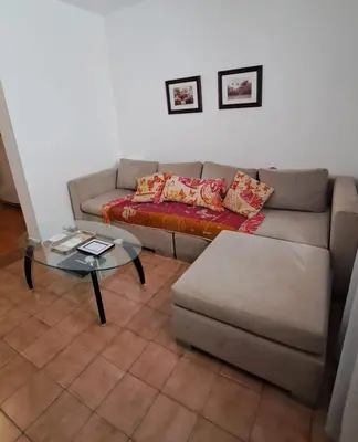 a living room with a couch and a table at Apartamento -Alberdi Chic B- Barrio cercanos Nueva Córdoba, Güemes, Alberdi, By Apartcba in Cordoba