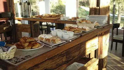 a buffet of bread and pastries on a table at Zahrek Resorts & SPA in San Javier