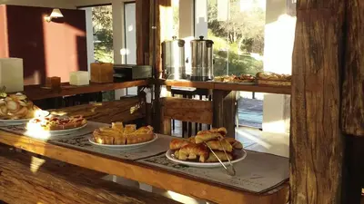 a table with several plates of bread and pastries at Zahrek Resorts & SPA in San Javier