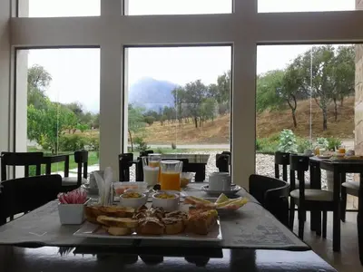 a table with a tray of food and drinks on it at Zahrek Resorts & SPA in San Javier