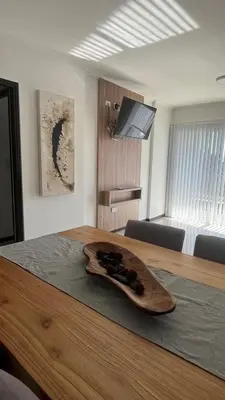 a wooden plate sitting on top of a wooden table at Veneto Village Resort & Spa in Villa Carlos Paz