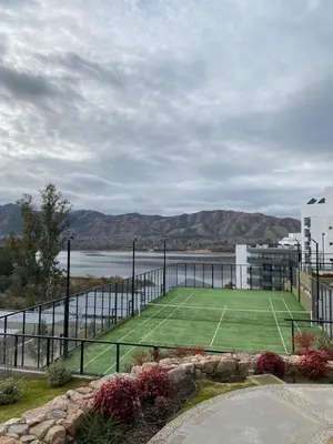 a tennis court sitting on top of a building at Veneto Village Resort & Spa in Villa Carlos Paz