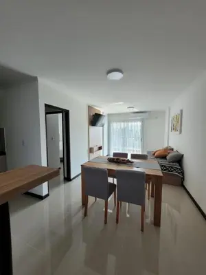 a kitchen and dining room with a table and chairs at Veneto Village Resort & Spa in Villa Carlos Paz