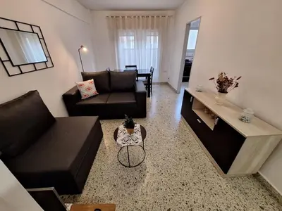 a living room with a couch and a table at Depto Carlos I in Villa Carlos Paz