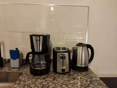 two appliances sitting on a counter in a kitchen at TERRAZA TERRAZA Merlo Apartments in Merlo