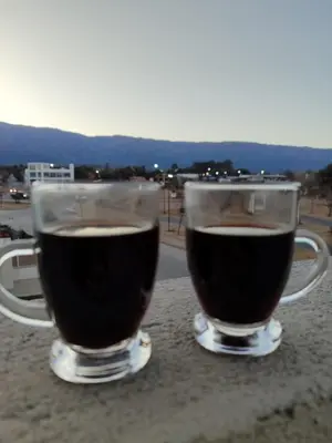 two cups of coffee sitting on a table at TERRAZA TERRAZA Merlo Apartments in Merlo
