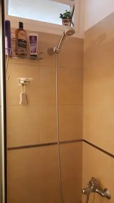 a shower in a bathroom with a sink at Depto Elba centro opcion cochera in Cordoba