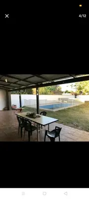 a picnic table and chairs under a tent at Excelente casa, Ideal para Familia Fines de Semana in Cordoba