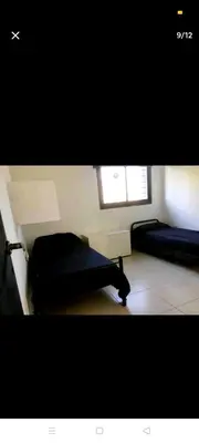 a room with two beds and two windows at Excelente casa, Ideal para Familia Fines de Semana in Cordoba