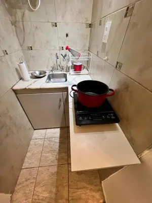a kitchen with a pot on top of a stove at Bello Departamento PB en mejor zona de nva cba atencion personalizada in Cordoba