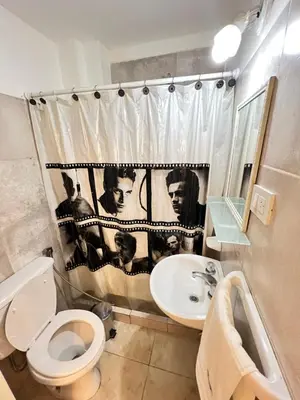 a bathroom with a toilet and a sink at Bello Departamento PB en mejor zona de nva cba atencion personalizada in Cordoba