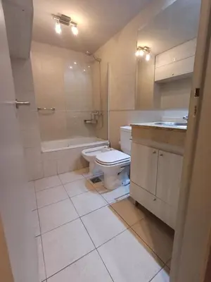 a bathroom with a toilet and a sink at Moderno departamento/Loft Córdoba - Coral State in Cordoba