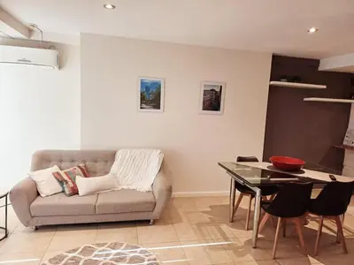 a living room with a couch and a table at Moderno departamento/Loft Córdoba - Coral State in Cordoba