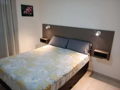 a bedroom with a large bed with a large headboard at Kempes, Ferial Chateau in Cordoba