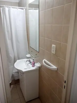a bathroom with a sink and a mirror and a shower at Kempes, Ferial Chateau in Cordoba