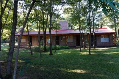 a brick house with trees in front of it at Santa Mate in Nono