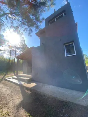 a building with a window on the side of it at cuatro vientos 1 in Santa Rosa de Calamuchita
