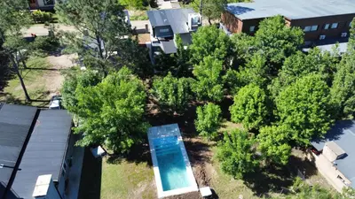 an overhead view of trees and a swimming pool at cuatro vientos 1 in Santa Rosa de Calamuchita